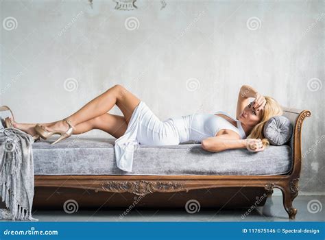 Portrait Of A Beautiful Woman On A Antique Sofa Stock Photo Image Of