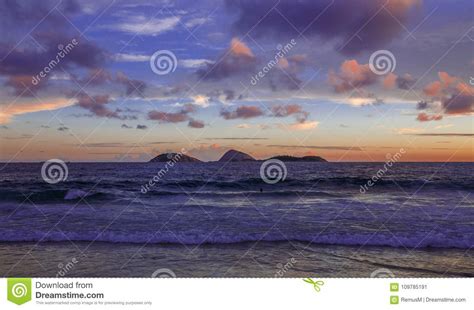 Sunset On The Beach In Ipanema Water Mountain And Sky Stock Image