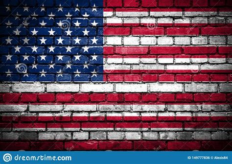 Brick Wall With Painted Flag Of United States Of America Stock