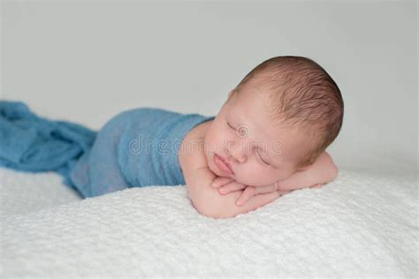 Sleeping Newborn Baby Boy Swaddled In Blue Stock Photo Image Of