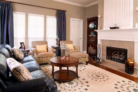 This sofa set features a luxurious italian leather upholstery that provides an unmatched level of comfort and quality. Karlin O'Neal - Decorating Den Interiors | Black sofa ...