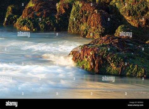 Waves Breaking Against The Rocks Stock Photo Alamy