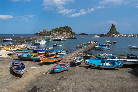 Aci trezza (aci castello acitrezza) is a nice fishing village with a beautiful seaside promenade (aci trezza riviera dei ciclopi) and a comfortable marina. Aci Trezza - Filled with Sicilian Sunshine and Smiles