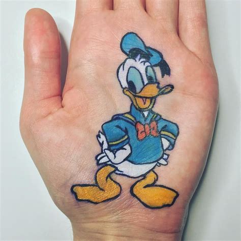 Donald Duck Hand Art By Magictouch Mua Instagram Disney Cartoon Character Tattoos Disney