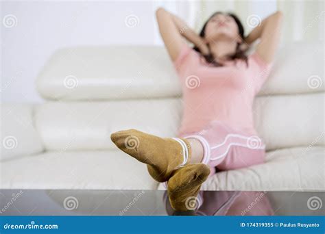 Beautiful Napping Woman On A Couch Feet With Socks Stock Image Image