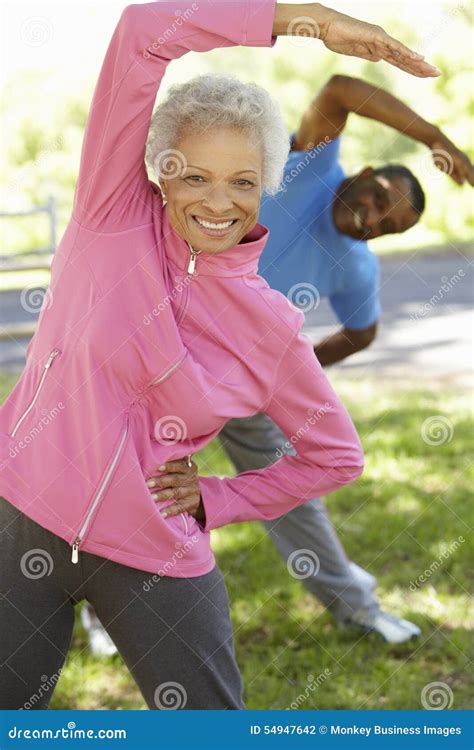 Senior African American Couple Exercising In Park Stock Photo Image