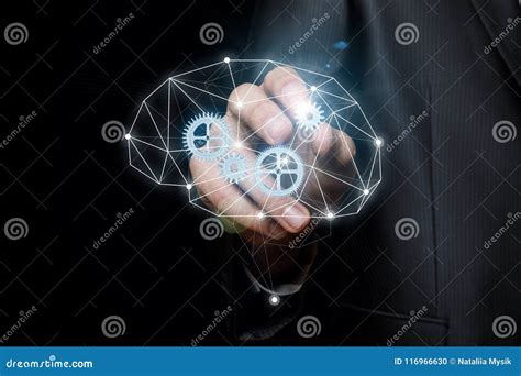 Businessman Inserts The Gear Into The Mechanism Of Thinking Stock