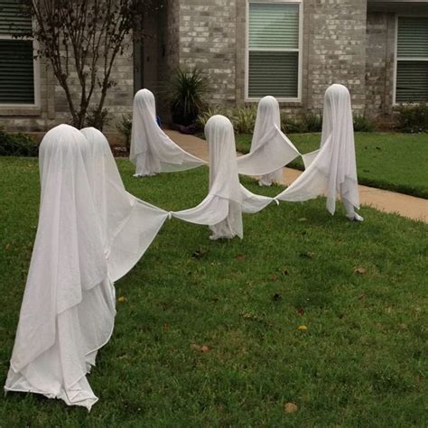 Dancing Ghosts Made Out Of Bed Sheets Tied Together Styrofoam Balls And Broom Sticks You