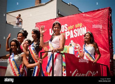 hispanic beauty queens travel on a float sponsored by coca cola in the dominican day parade in