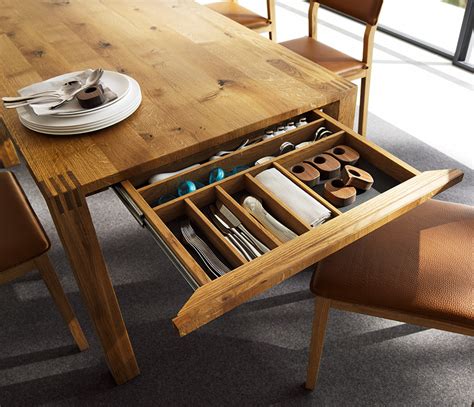 The tabler collection is made from solid wood and finished in a distressed driftwood grey finish. Luxury solid wood table - Loft TEAM 7 - Wharfside