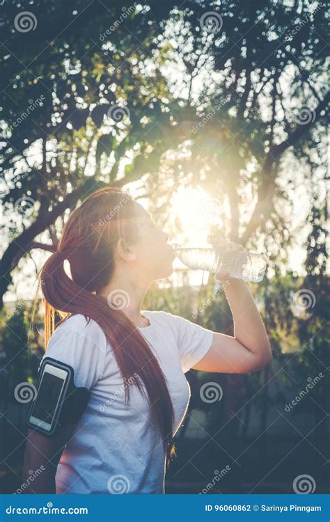 Fitness Beautiful Woman Drinking Water And Sweating After Exercising