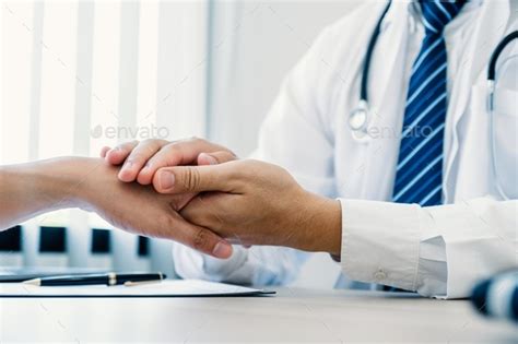 Doctor Hands Holding Patient Hand To Encourage And Explained The Health