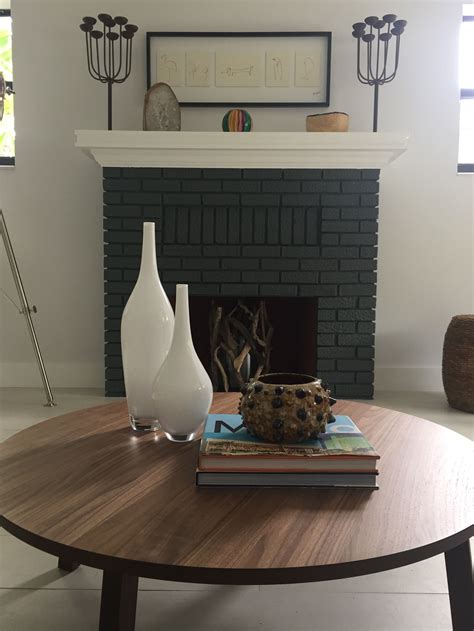 Not pictured is our coffee table which is an antique brushed metal table also. Fireplace and coffee table styling, Miami bungalow ...