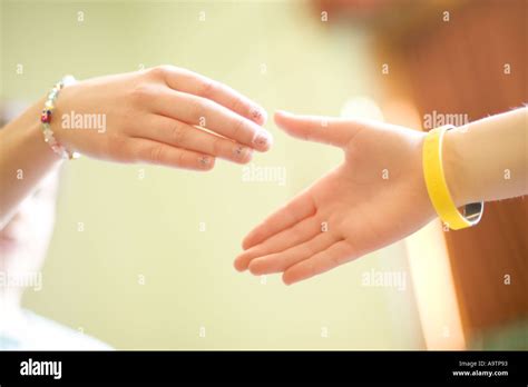 Two Girls Playing Hand Clapping Game At School Stock Photo Alamy