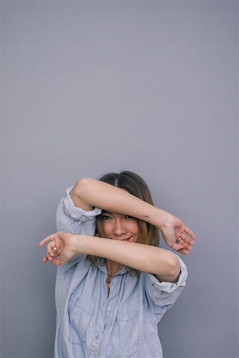Woman Showing Her Face Through Arms By Stocksy Contributor Danil Nevsky Stocksy