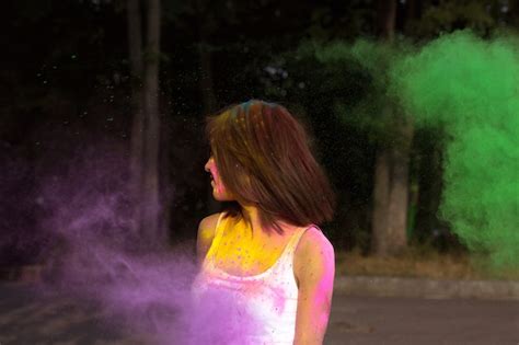 Premium Photo Stylish Brunette Woman With Short Hair Posing With Exploding Green And Purple