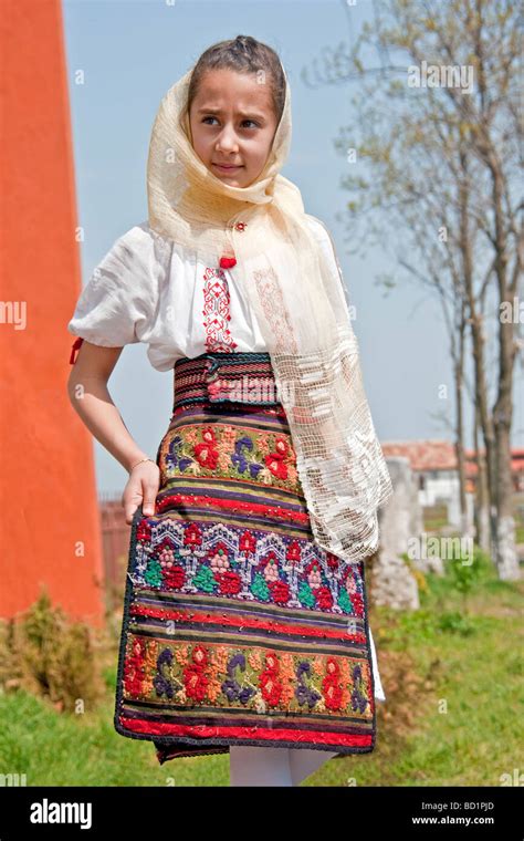Romanian Girl Wearing Traditional Embroidered Skirt At Histria Museum