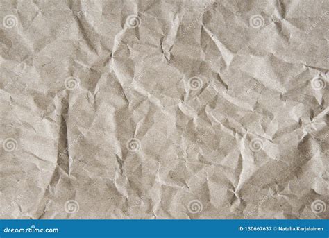 Brown Crumpled Wrapping Paper Background Texture Of Yellow Wrinkled Of
