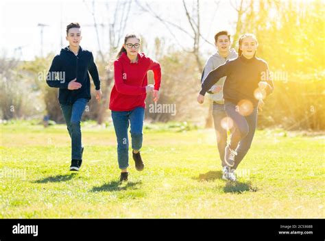 Teenage Boy Girl Running Park Hi Res Stock Photography And Images Alamy