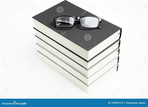 A Neatly Stacked Set Of Five Books With Reading Glasses Stock Image Image Of Book Library