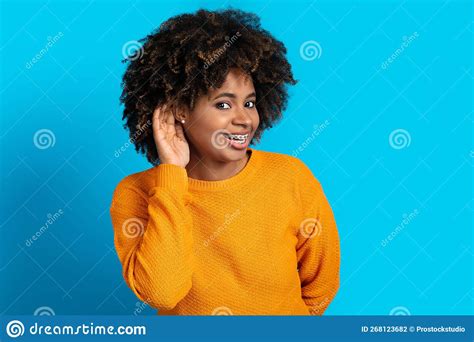 Beautiful African Woman Holding Hand Near Ear Trying To Listen Stock