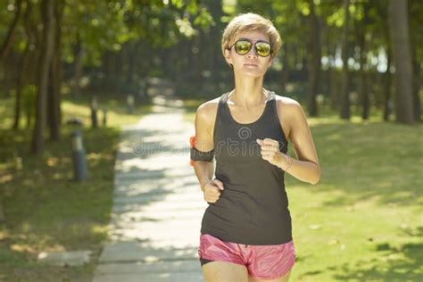 Young Woman Jogging In Green Park In Morning Stock Image Image Of