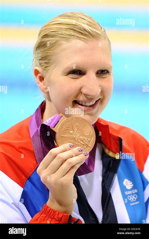 great britain s rebecca adlington poses with her bronze medal following the presentation