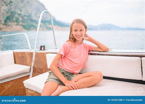 Little Girl Sailing On Boat In Clear Open Sea Stock Photo Image Of