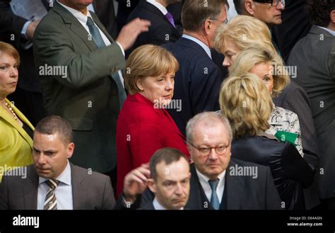 Angela Merkel Is Pictured Amidst Members Of Parliament After Altmaiers