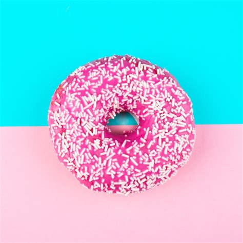 Premium Photo Pink Donut With Sprinkles