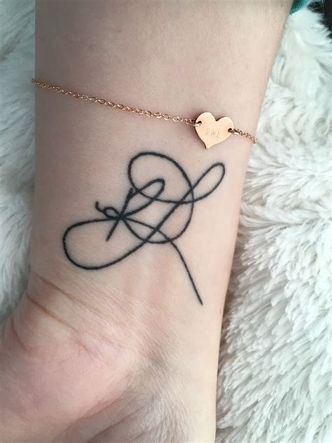 Simple Initial Tattoos On Wrist