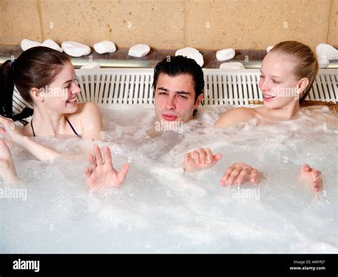 One Man With Two Women In Jacuzzi At A Spa Stock Photo Alamy