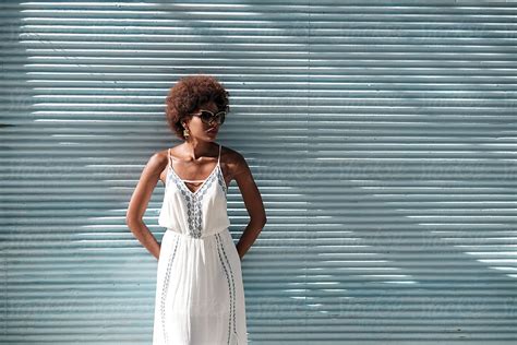 portrait of fashionable african woman wearing white dress by stocksy contributor brkati