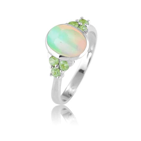 Iridescent Opal Lit By Green Sapphires