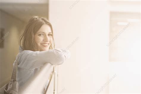 Young Woman Leaning On Railing Portrait Stock Image F0112493