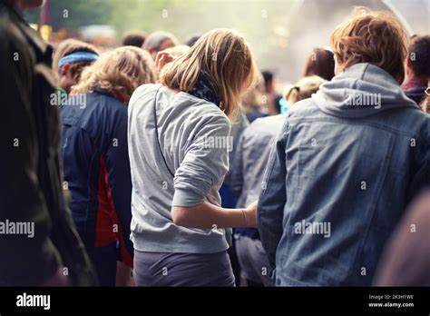 Adoring Audience Rear View Of A Crowd Dancing At An Outdoor Music