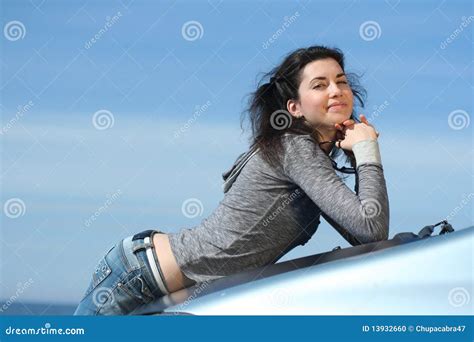 The Beautiful Brunette On A Car Cowl Stock Photo Image Of Girl