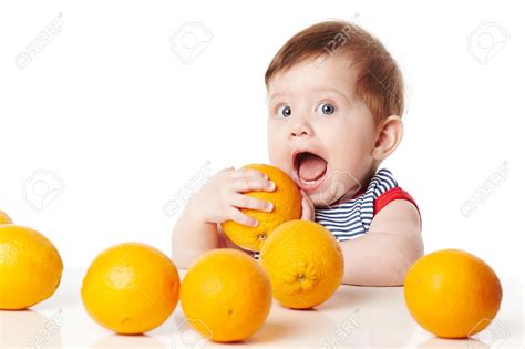 18767393 Cute Baby With Orange Isolated On White Stock Photo Baby