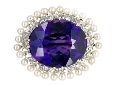 A Stunning Edwardian Brooch Composed Of An Oval Siberian Amethyst