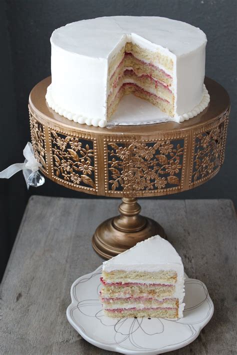 If you are having an afternoon tea wedding reception, then why not use a few pretty pieces of china crockery and bunting around your cake display to accentuate the theme. Lemon Raspberry Layer Cake- The Little Epicurean