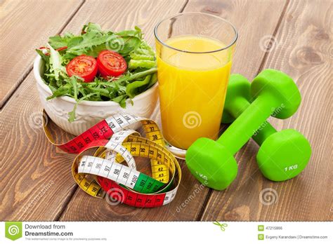 Dumbells Tape Measure And Healthy Food Fitness And Health Stock Photo