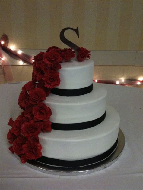 Six tier ribbon fondant wedding cake. Cascading Red Roses On Buttercream Wedding Cake ...