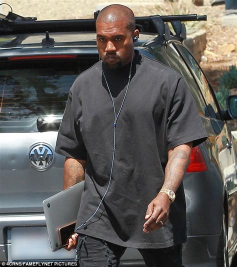 Kanye West Returns To The Office In Casual Attire Of Black T Shirt And
