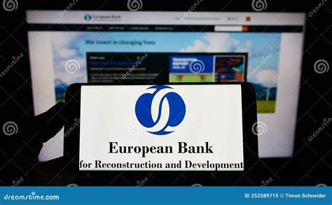Person Holding Smartphone With Logo Of European Bank For Reconstruction And Development Ebrd
