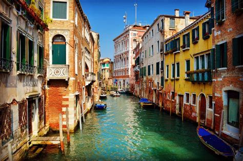 It's dreamy and romantic, with an undercurrent of mystery and drama. Grand Canal, Venice, Italy - Beautiful colourful houses on ...