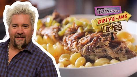 guy fieri eats barbecue pulled pork mac and cheese diners drive ins and dives food network