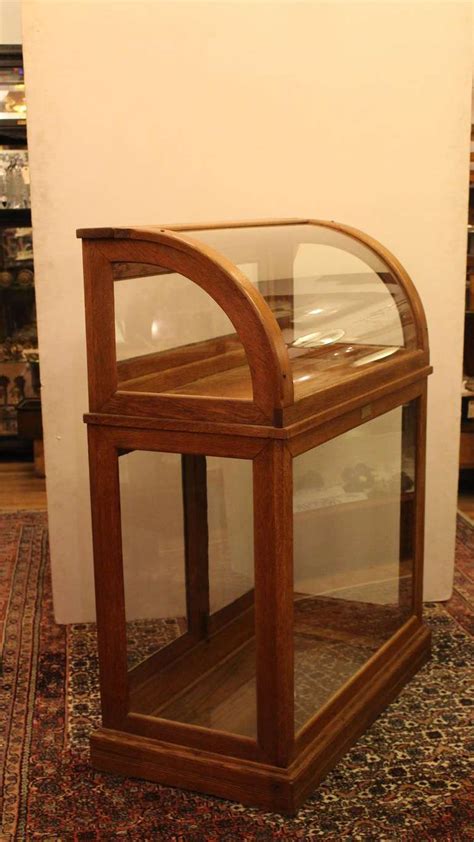 Antique Oak Display Case With One Shelf And Curved Glass Front At