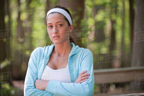 Hispanic Woman With Arms Crossed Stock Photo Dissolve