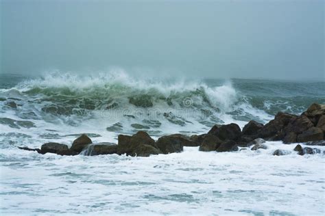 Sea Storm Waves Dramatically Crashing And Splashing Against Rocks Stock