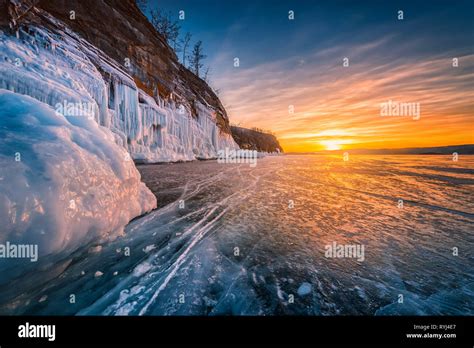 Sunset Sky With Natural Breaking Ice Over Frozen Water On Lake Baikal